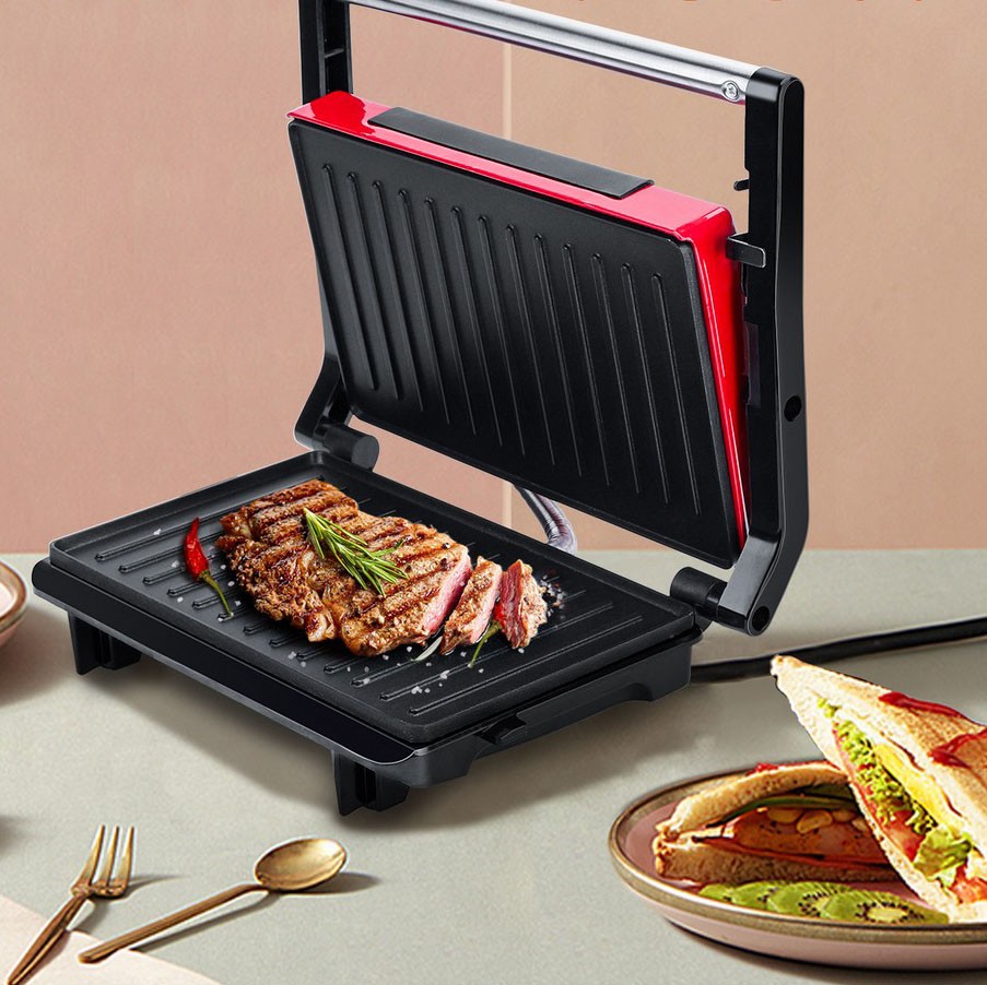 23,95 € Kostenloser Versand | Küchengerät Aigostar 750W 28×22 cm. Grill, Grill und Paninimaschine Aluminium. Schwarz und rot Farbe